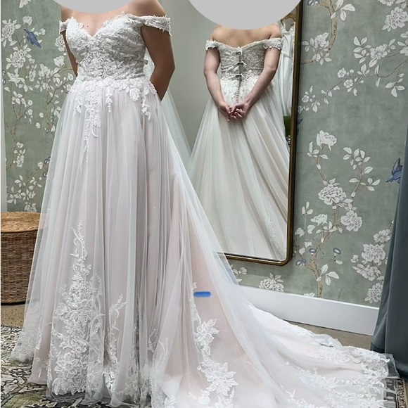 Dresses & Skirts - A contemporary white lace and tulle wedding dress with